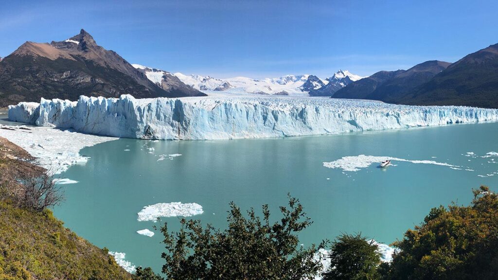 glacier next to a body of water