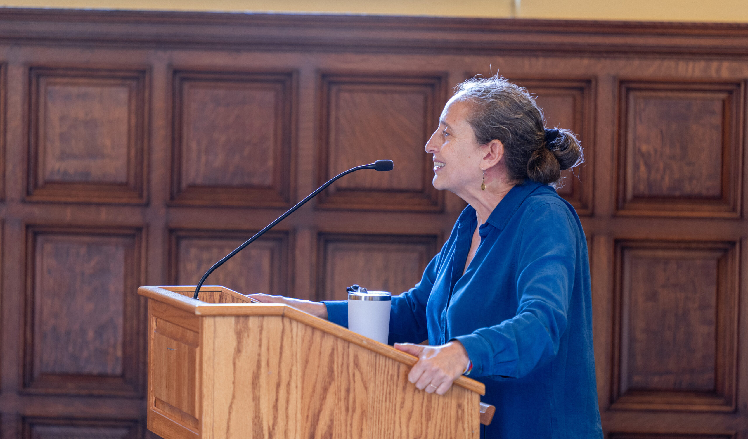 ruth defries speaking at a stand