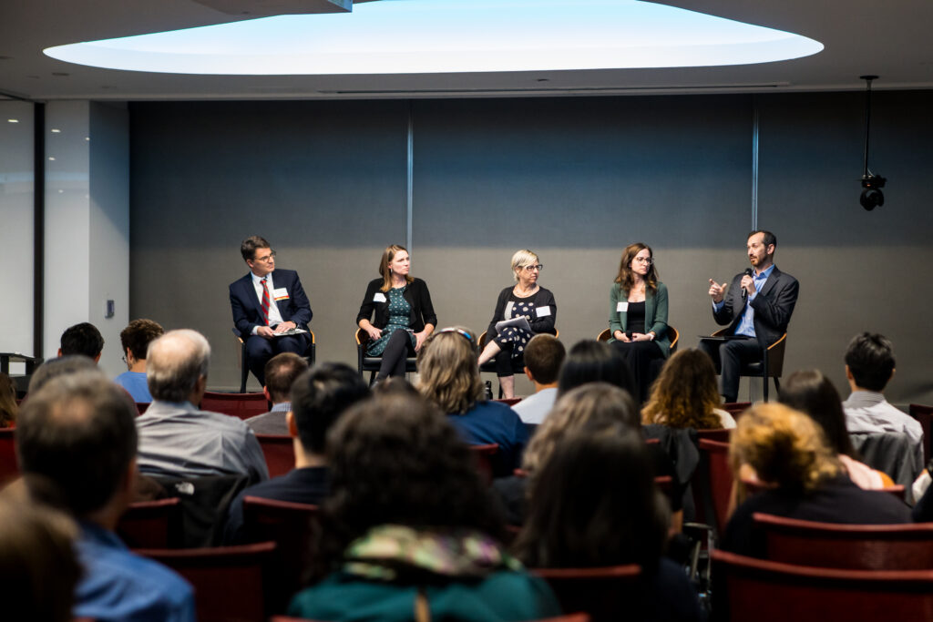 panel speaking on stage